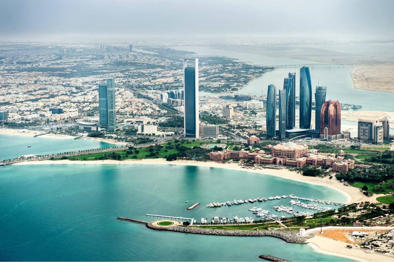 corniche beach with city skyline
